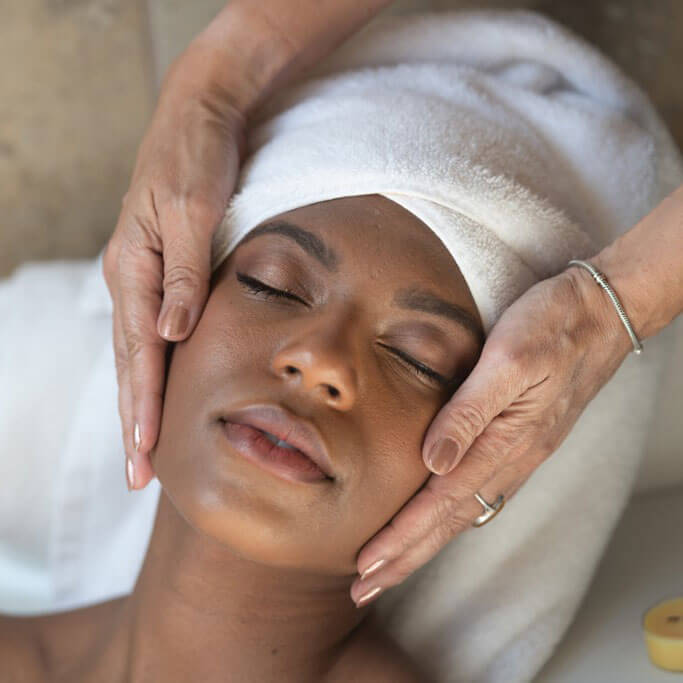 dark skinned woman receiving HydraFacial service in Fort Worth, TX
